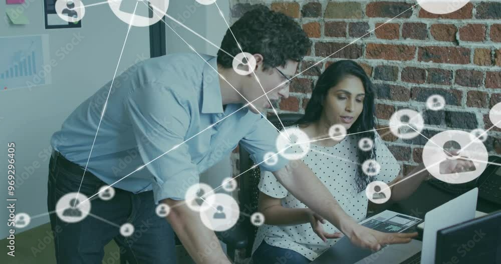 Poster animation of network of connections with icons over diverse colleagues using laptop in office