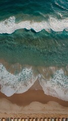 Aerial View of a Serene Mediterranean Beach with Crystal Clear Waters, Cliffs, and Vibrant Umbrellas – iPhone Wallpaper 