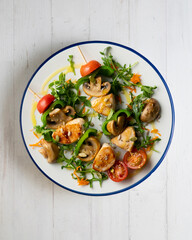 Turkey skewers with mushrooms and vegetables. Top view table.