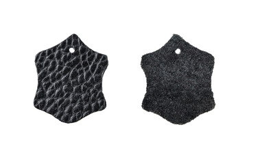 Leather piece label of black color isolated on a white background with clipping path. Set of leather piece label. Mark of production from genuine or artificial leather.