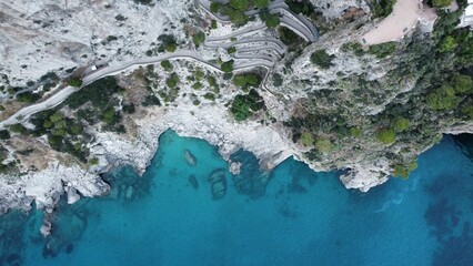 Aerial footage of the historic footpath of Via Krupp, in daytime in the island of Capri, Italy