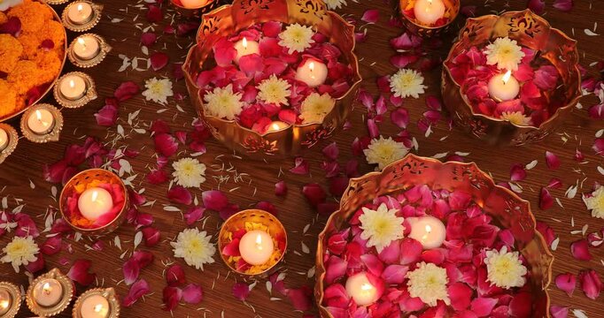 Top footage of the candles and colorful decorations for Diwali festival, on a wooden floor