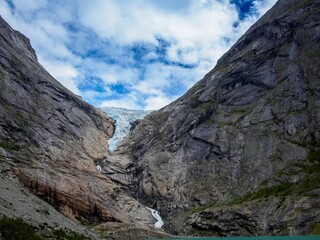 Glacier nestled between rugged mountains