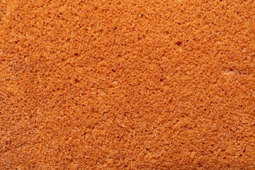 Tasty sponge cake as background, top view