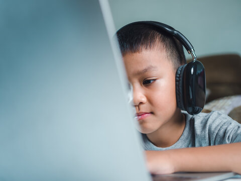 Online education, Technology studying at home using laptop computer, Student distance learning virtual distance online class on video call virtual lesson, Teaching child boy with remote education.