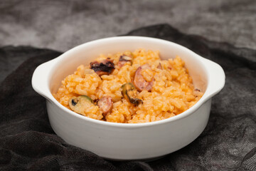 traditional portuguese dish rice with seafood in white dish