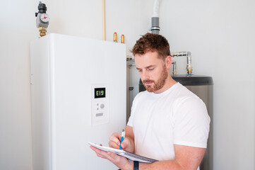 Technician checks the operation of a heat pump in a house.