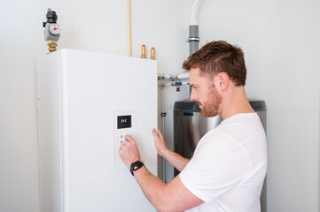 Technician checks the operation of a heat pump in a house.