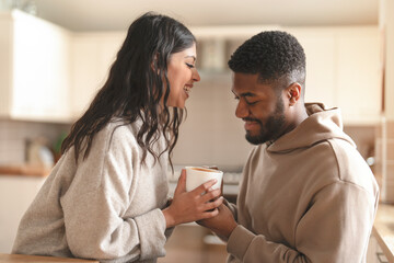 Joyful Morning Moment Shared Between Two Friends Over Warm Coffee in Cozy Kitchen