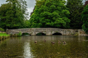 Obraz premium Ashford in the Water medieval three arch sheep wash bridge in the Peak District National Park.