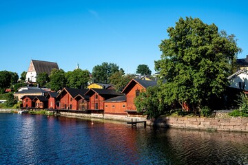 Traditional red wooden houses by the river in Porvoo, Finland.