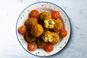 Vegan Chickpea balls coated with panko. Top view table.