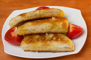 white bread with olive oil and coarse salt and oregano, bread with olive oil, appetizer, fried bread with olive oil and tomatoes