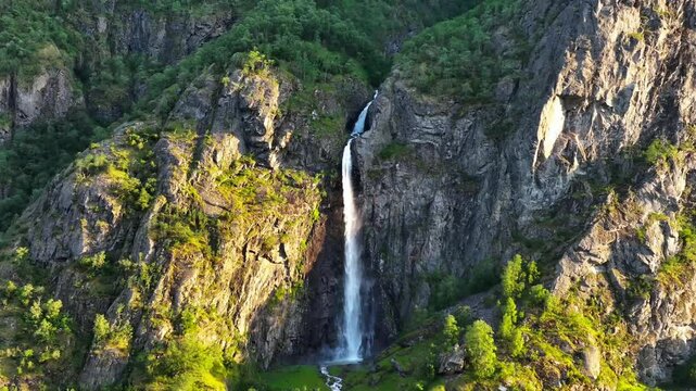 Boafossen waterfall flowing on rocky mountain, on a sunny day in Sogn og Fjordane, Laerdal, Norway