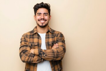 Obraz premium Young hispanic man standing over isolated background happy face smiling with crossed arms looking at the camera. positive person with generative ai