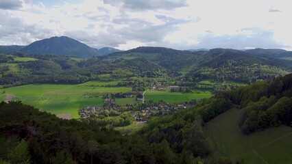 Serene Valley Village Amidst Verdant Mountains
