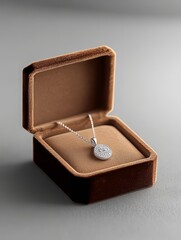 Elegant silver necklace in a plush jewelry box, perfect for gift-giving or special occasions.