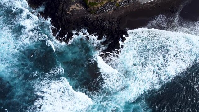 Aerial view of powerful waves crashing on the rocky coastline of Acores, Portugal.