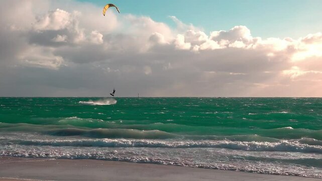 A man does kitesurfing