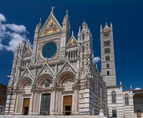 Stunning facade of Siena Cathedral under a clear blue sky