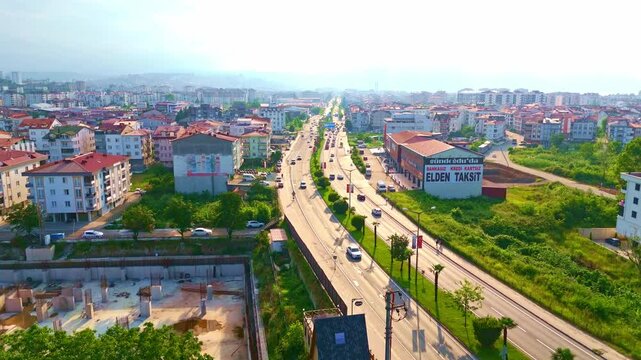 Aerial view a city with a highway.