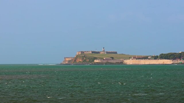 El Morro Bay with a big cruise ship and Castillo San Felipe del Morro, on a sunny day in Puerto Rico