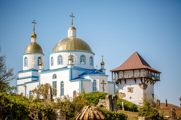 Blue Church and Old Tower in an open air nature reserve. Busha village. Ukraine