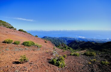 A stunning mountain landscape with clear blue sky and lush greenery, Madeira Island, Portugal
