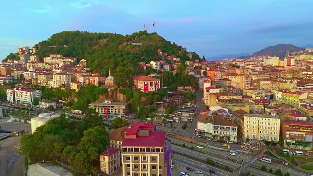 Aerial view a city with a hill.