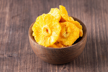 Dried pineapple in a bowl. Dried fruits. 