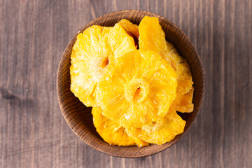 Dried pineapple in a bowl. Dried fruits. 