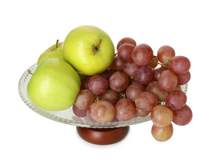 Glass vase with fresh grapes and apples isolated on white