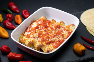 burritos baked with tomato sauce and cheddar cheese