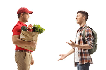 Courier delivering a grocery bag to a teenage student