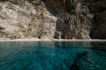 Scenic view of serene, turquoise waters and coastal cliffs on a sunny day in Zakynthos, Greece