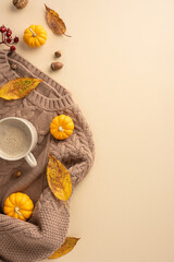 Warm vertical autumn scene featuring a knitted sweater, steaming coffee, small pumpkins, and fall leaves, evoking a cozy and comforting atmosphere