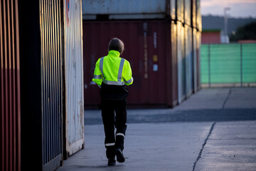 Engineer industry jackets and hard hats standing in an industrial area,  refinery or power plant....