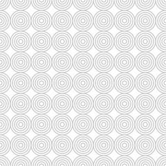 A repetitive pattern of concentric circles in light gray tones, suitable for backgrounds or graphic designs.