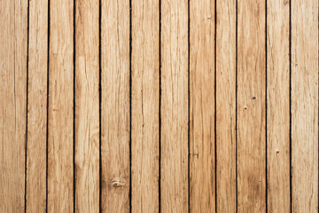 Close-up of a weathered wooden surface with vertical planks.