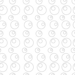 A pattern of various sized circles on a white background, creating a minimalist and modern design.