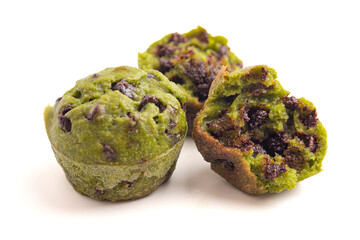 Bright Green Spinach Chocolate Chip Mini Muffins Isolated on a White Background
