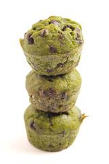 Bright Green Spinach Chocolate Chip Mini Muffins Isolated on a White Background