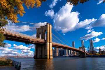 Fototapeta premium New York iconic landmark Brooklyn Bridge at sunset, with the warm light casting a golden hue over the structure