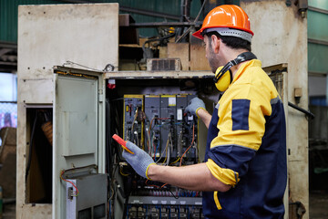 Fototapeta na wymiar engineer or technician operating industrial control panel in the factory
