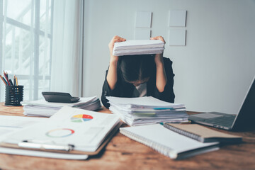 Overwhelmed: A businesswoman, buried under a mountain of paperwork, grapples with the overwhelming demands of her job. 