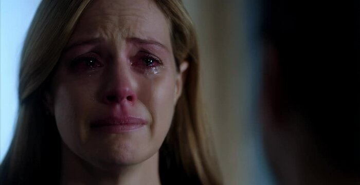 The woman is crying. Close-up eyes and tears.