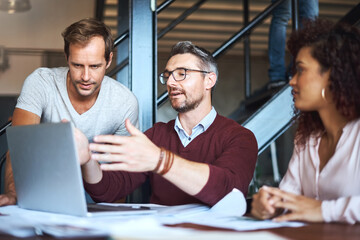 Group, creative and discussion of project, laptop and review of footage, cinematographer and planning. Talk, feedback and teamwork for movie, director of photography and people with ideas in office