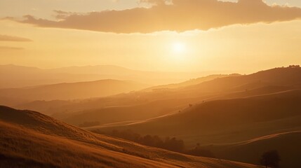 A sky during the golden hour, with the sun casting warm light across a landscape of rolling hills.