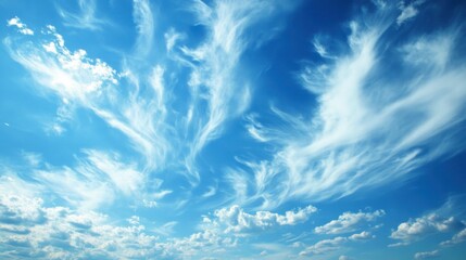 A sky filled with wispy cirrus clouds stretching across the horizon, with a deep blue backdrop.