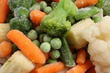 Mix of different frozen vegetables as background, top view